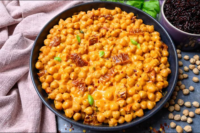 Creamy vegan Marry Me Chickpeas served with fresh herbs